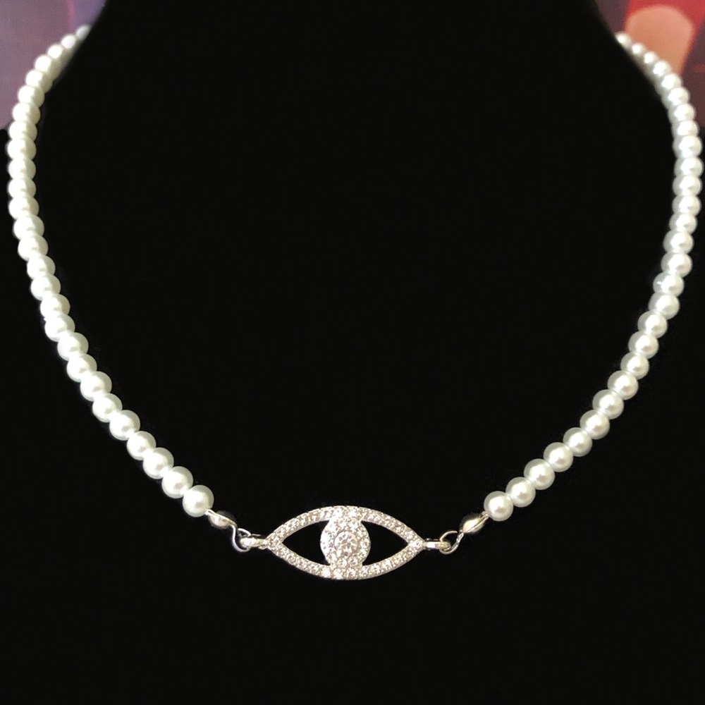 Pearl necklace with silver eye charm